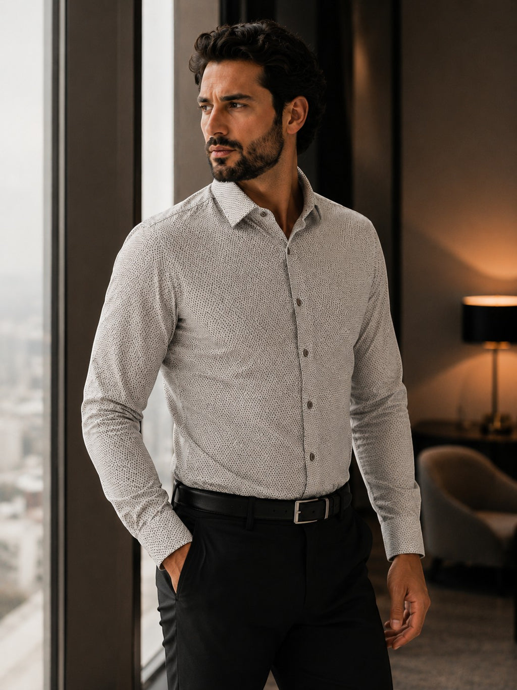 Barutti.ae beige micro-print modern-fit cotton shirt worn by a man standing by a window in a professional setting.