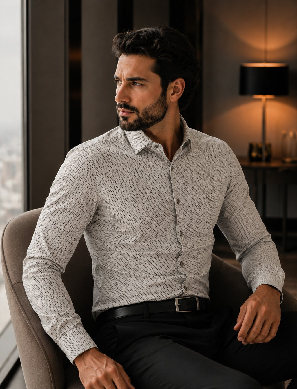 Barutti.ae modern-fit beige long-sleeve shirt with subtle micro-print worn by a man sitting in a luxury interior.