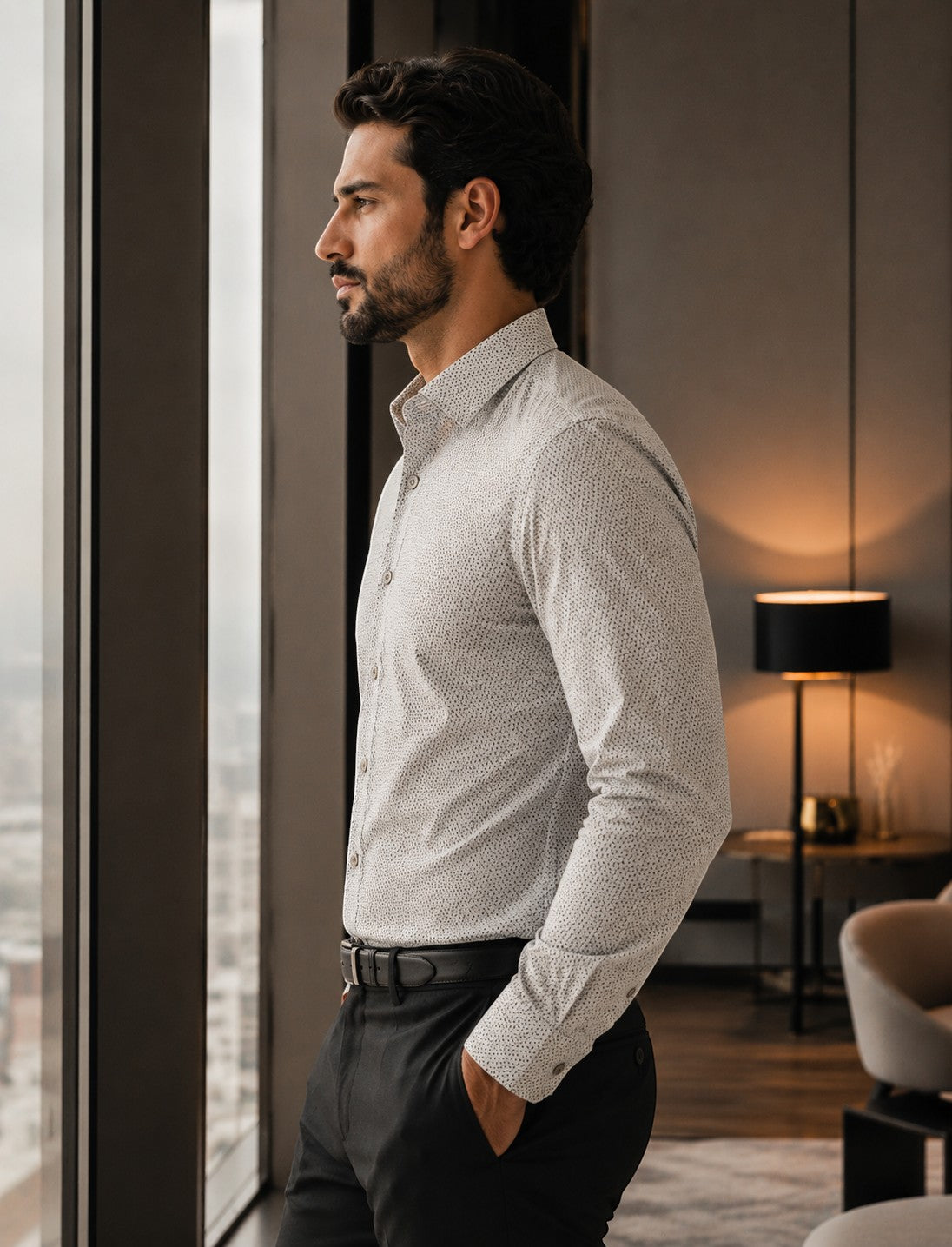 Barutti.ae Venti beige micro-print modern-fit cotton shirt worn by a man standing by a window in a modern office.