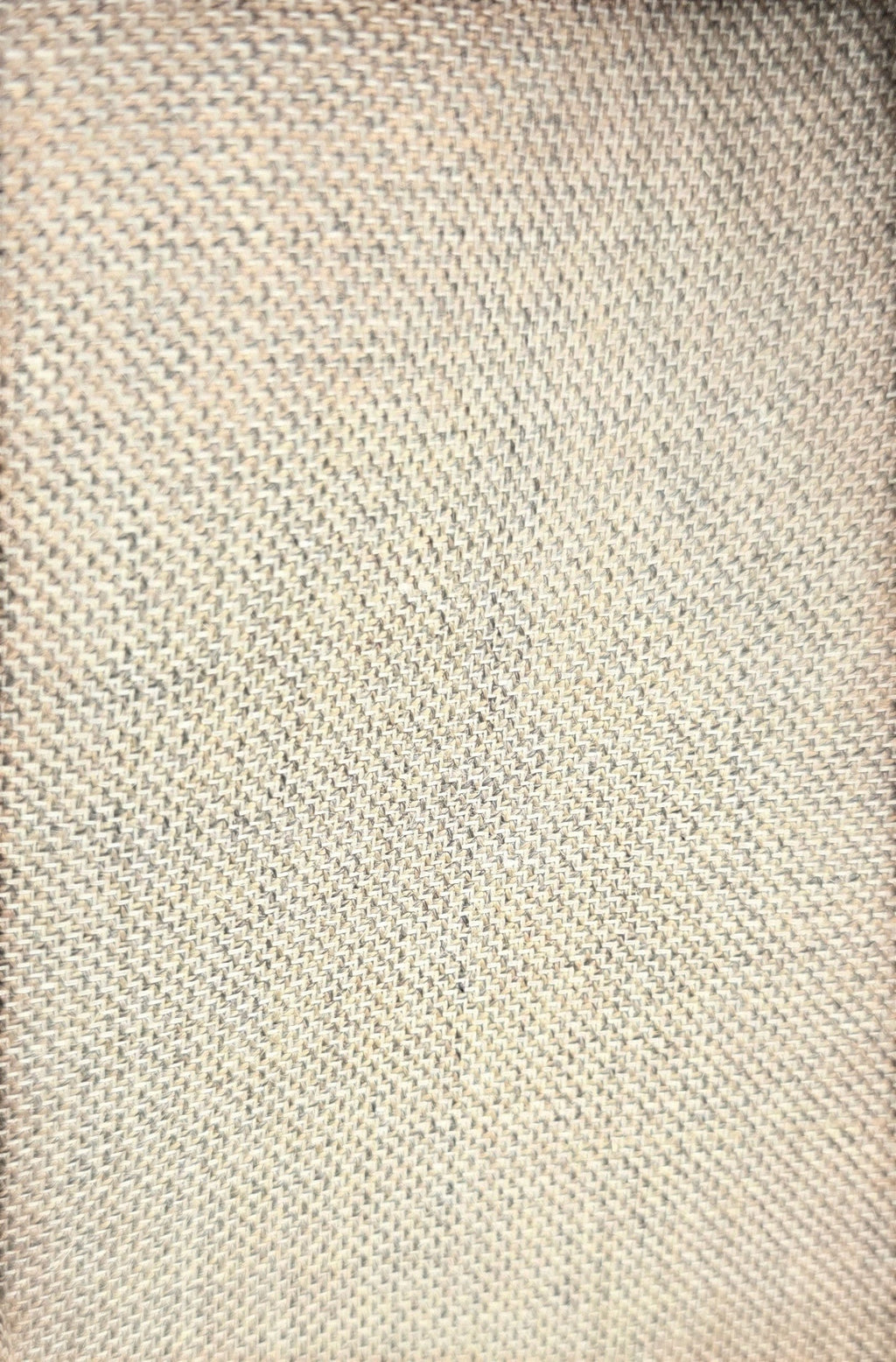 Close-up of the beige textured wool blend fabric from a Barutti.ae premium blazer showing the detailed weave.