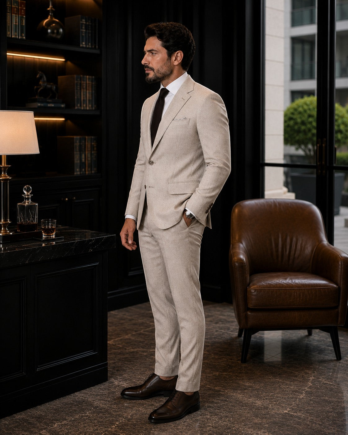 Barutti.ae beige textured wool blazer worn by a man in a dark office setting with a white shirt and dark tie.