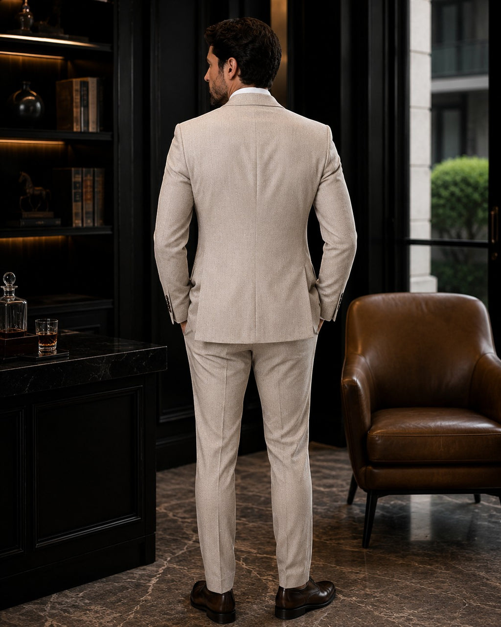 Barutti.ae beige textured wool blazer and trousers suit worn by a man from the back in a luxury office setting