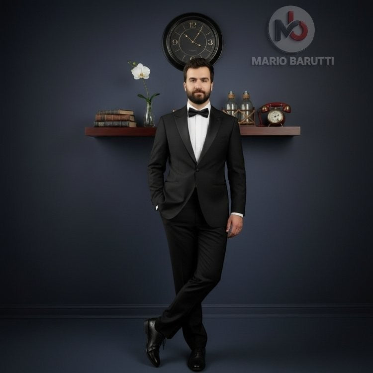 Man wearing a Mario Barutti black peak lapel tuxedo with a white shirt and bow tie in a classic studio setting.