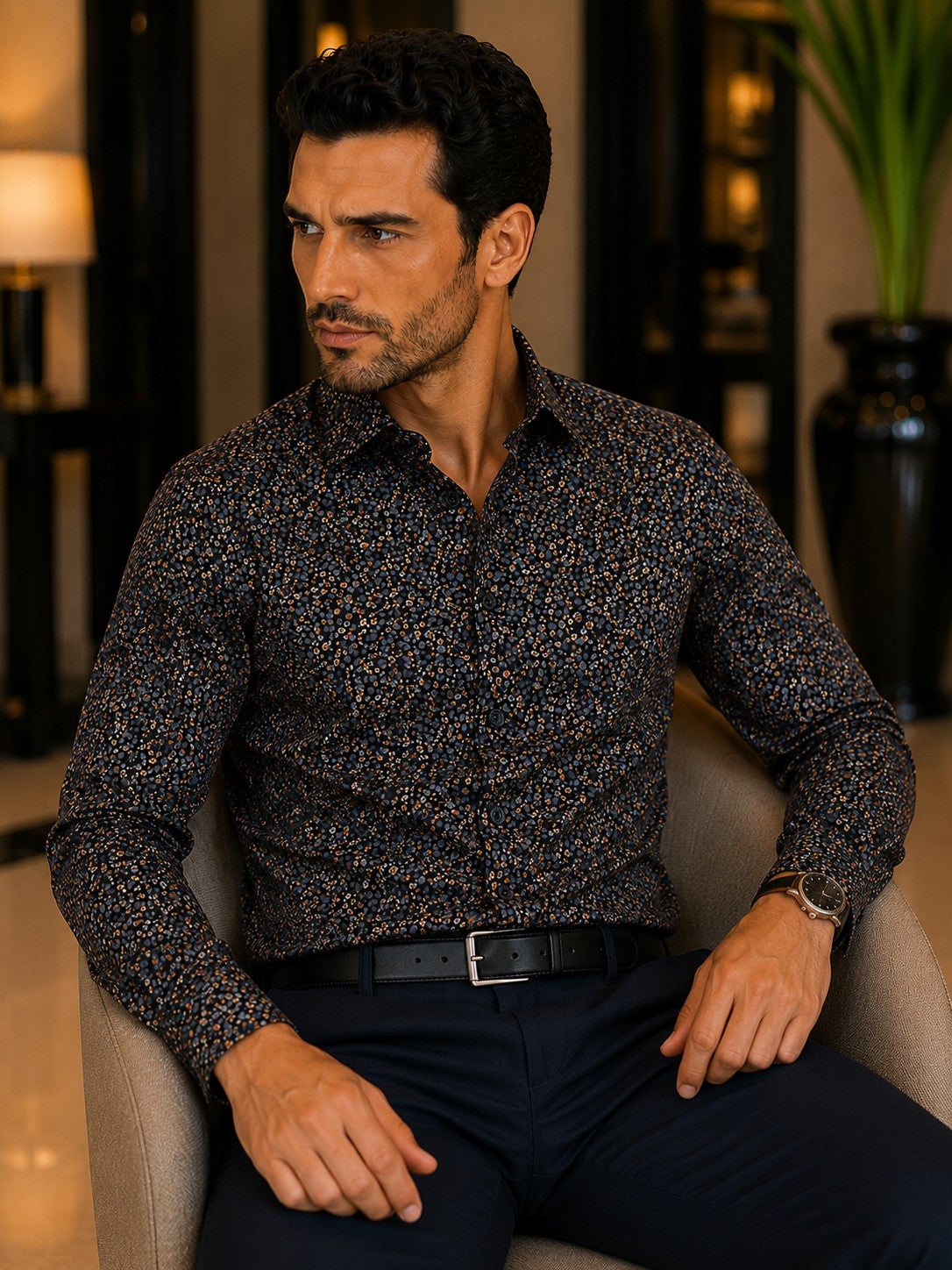 Barutti.ae Casamoda charcoal cotton shirt with orange and grey floral micro-print worn by a man in a lounge setting