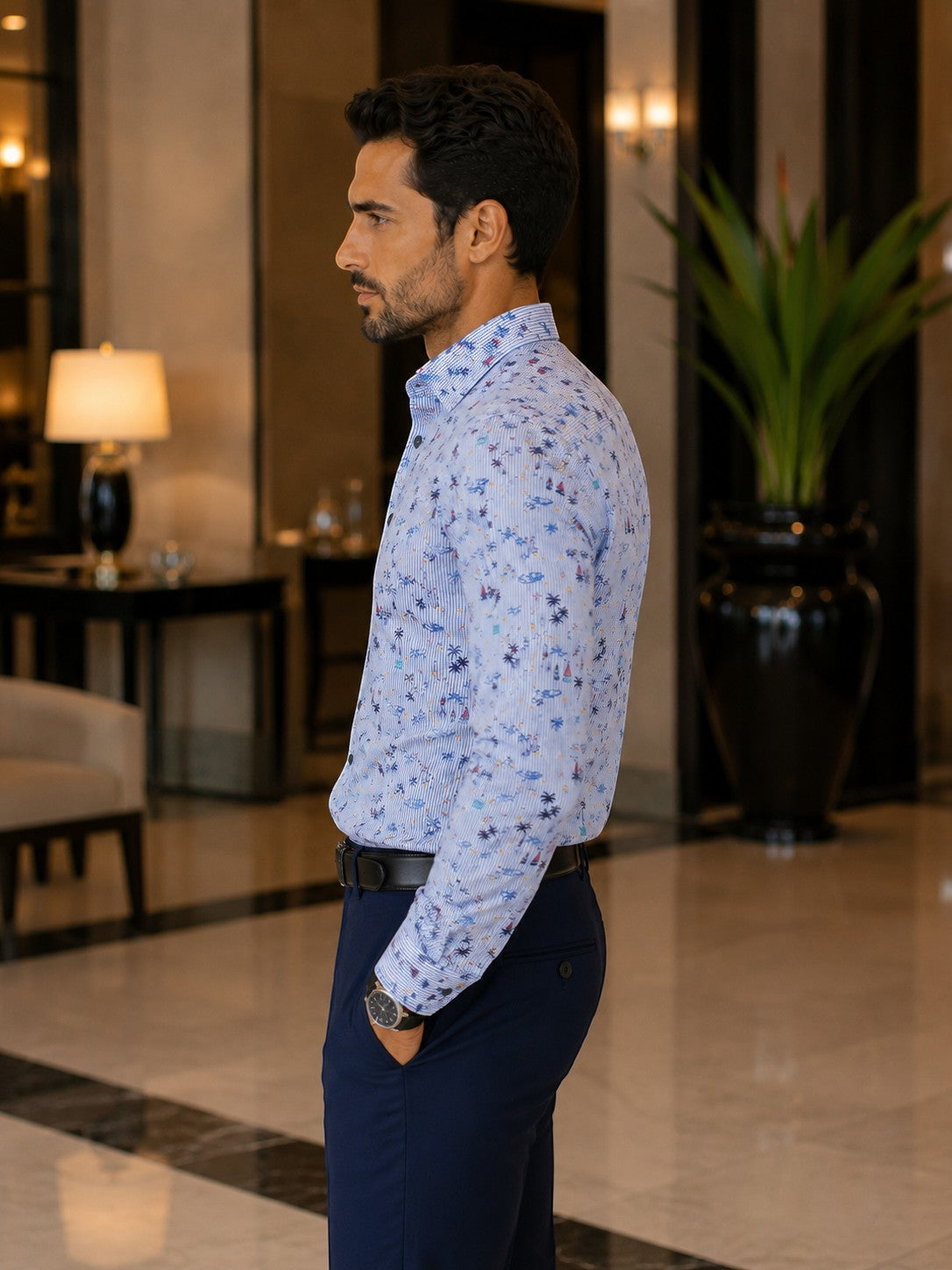 Barutti.ae Casamoda linen-blend shirt with nautical palm and sailboat print on blue pinstripes, worn by a man.