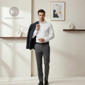 Man wearing a Casamoda off-white classic-fit dress shirt with grey trousers and a navy blazer