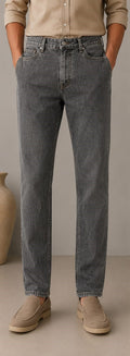 Barutti.ae charcoal grey classic fit denim jeans worn with a beige shirt and loafers for a polished casual look.