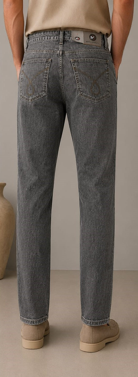 Barutti.ae charcoal grey classic fit denim jeans with back pocket stitching, worn by a man with beige loafers.