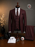 Barutti.ae maroon three-piece suit with blue check pattern, featuring a double-breasted waistcoat and tailored jacket.