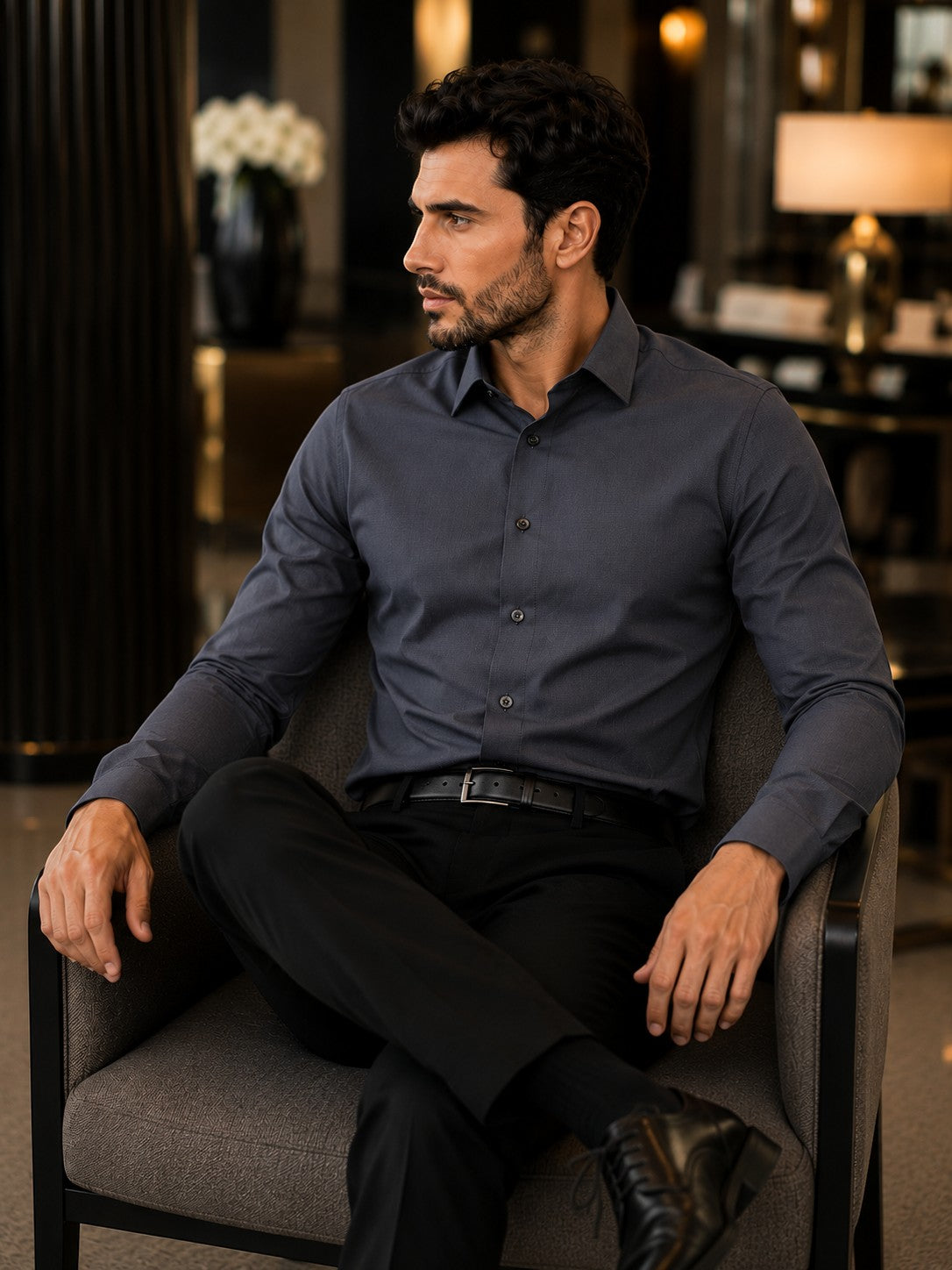 Barutti.ae Venti midnight navy modern-fit long-sleeve cotton shirt worn by a man sitting in a luxury interior.