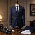 Barutti navy blue two-piece suit on a mannequin with a white dress shirt, tie, and black leather dress shoes.