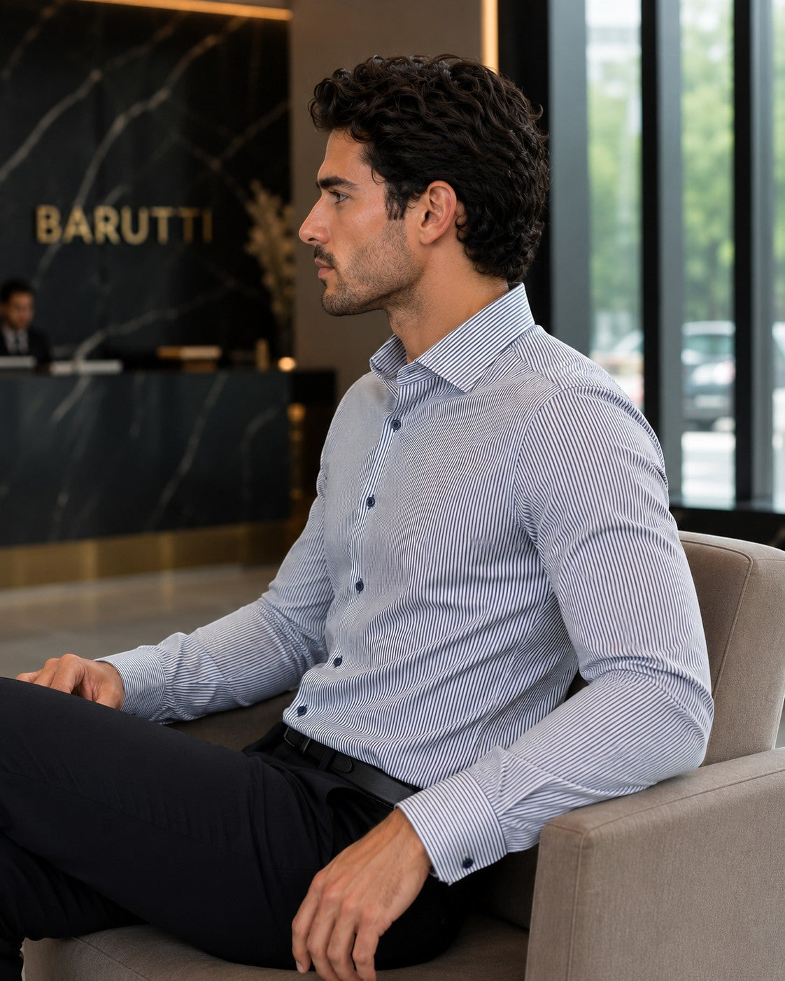Barutti.ae navy striped long-sleeve cotton shirt with structured collar worn by a man in a modern office setting