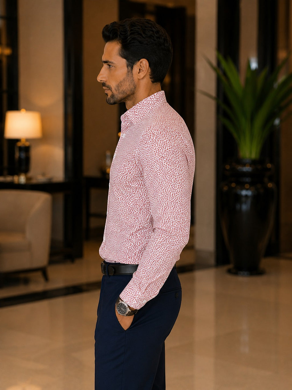 Barutti.ae modern-fit dress shirt in red and white micro-floral cotton worn by a man in a luxury interior.