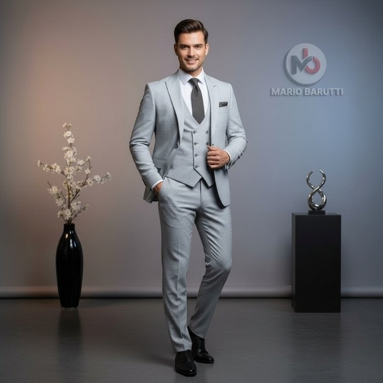 Marco Ricci model wearing a modern fit silver three-piece suit with waistcoat, white shirt, and grey tie.