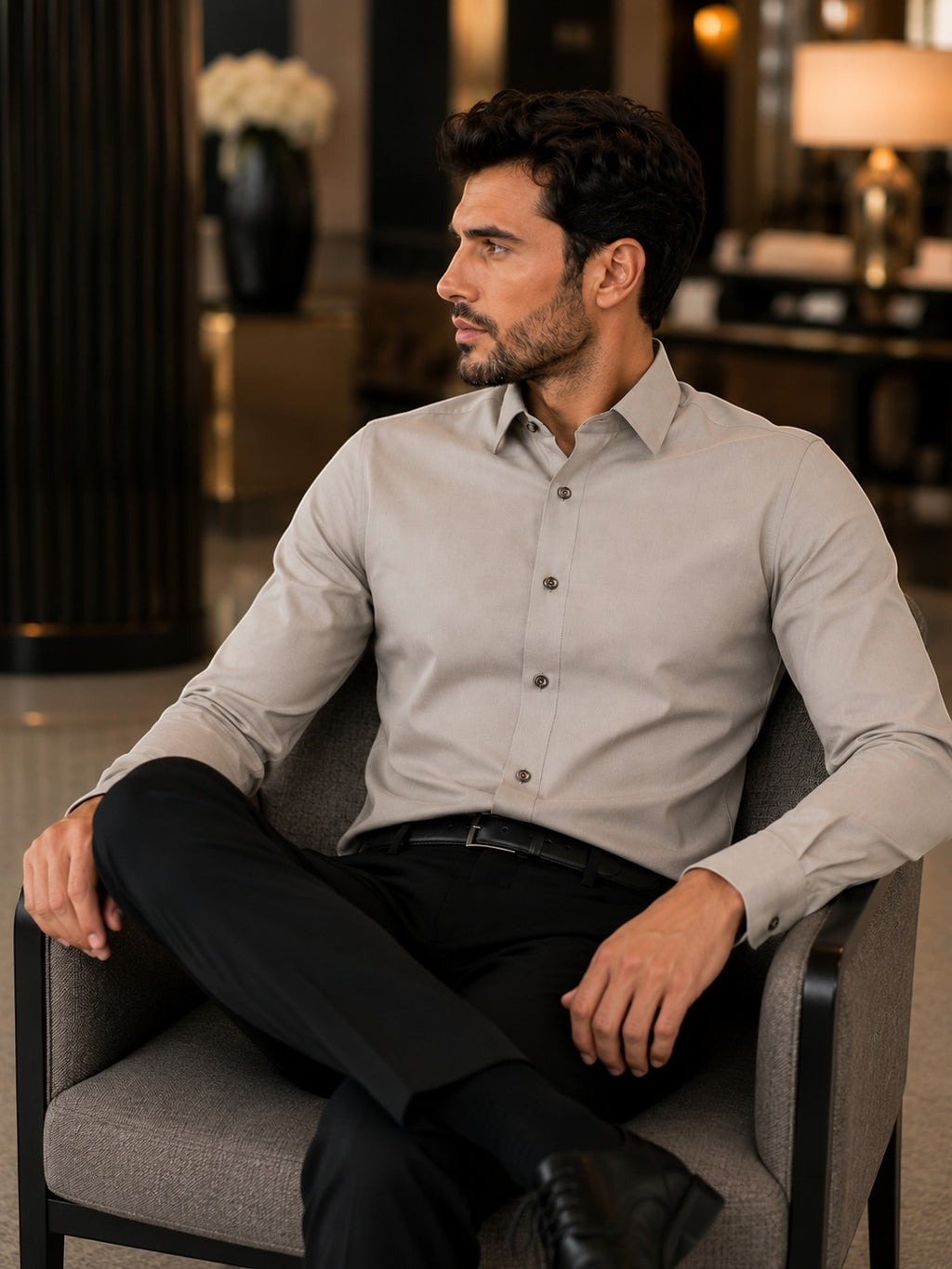 Barutti.ae Venti stone olive modern-fit long-sleeve cotton shirt worn by a man sitting in a formal lounge setting.