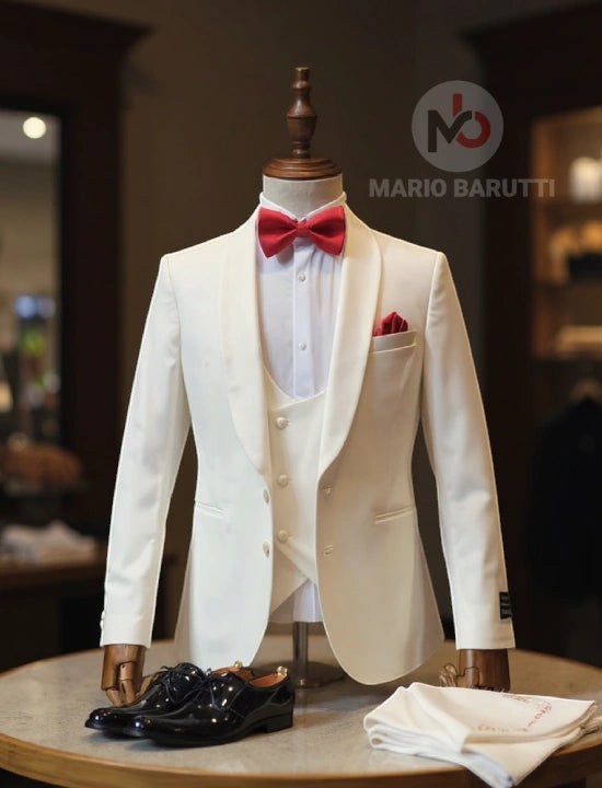 Mario Barutti white tuxedo jacket with shawl lapel, matching waistcoat, and red bow tie on a mannequin