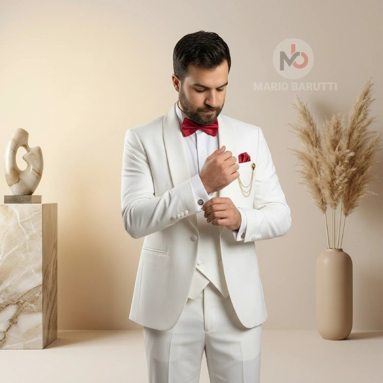 Mario Barutti white tuxedo with shawl lapel, red bow tie, and pocket square worn by a man in a modern studio setting.