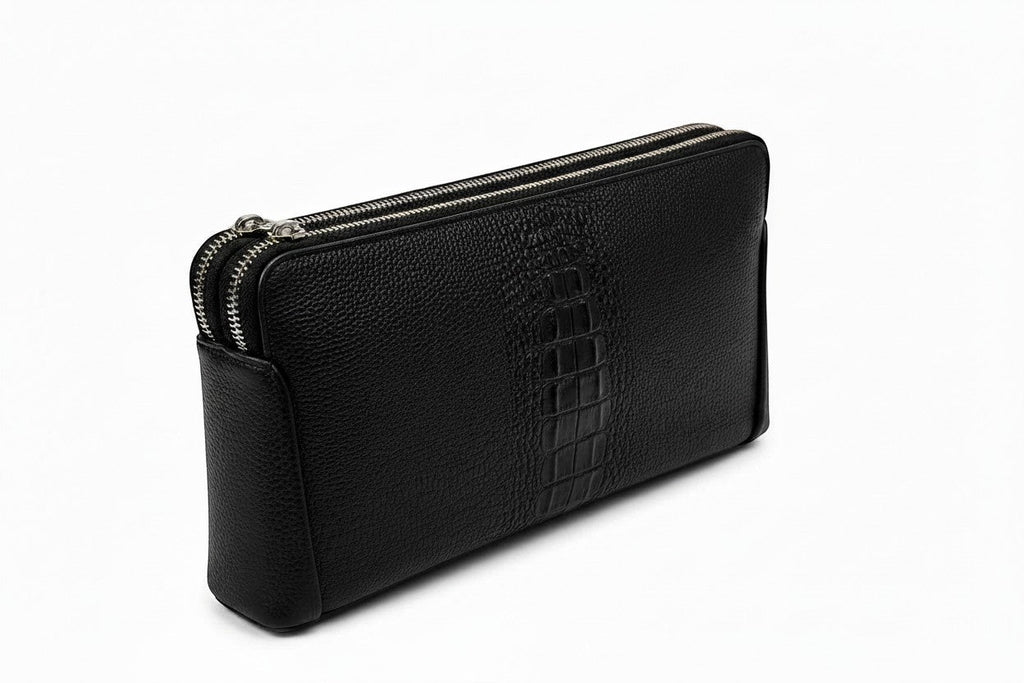 Barutti The Lecco black crocodile-embossed leather zip clutch with dual brass zippers.
