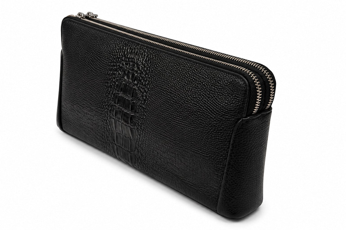 Barutti The Lecco black crocodile-embossed leather zip clutch with dual brass zippers.