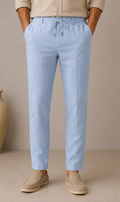 Man wearing Mario Barutti light blue linen drawstring trousers, front view, Mario Barutti Dubai