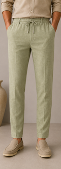 Man wearing Mario Barutti sage green linen drawstring trousers, front view, Mario Barutti Dubai