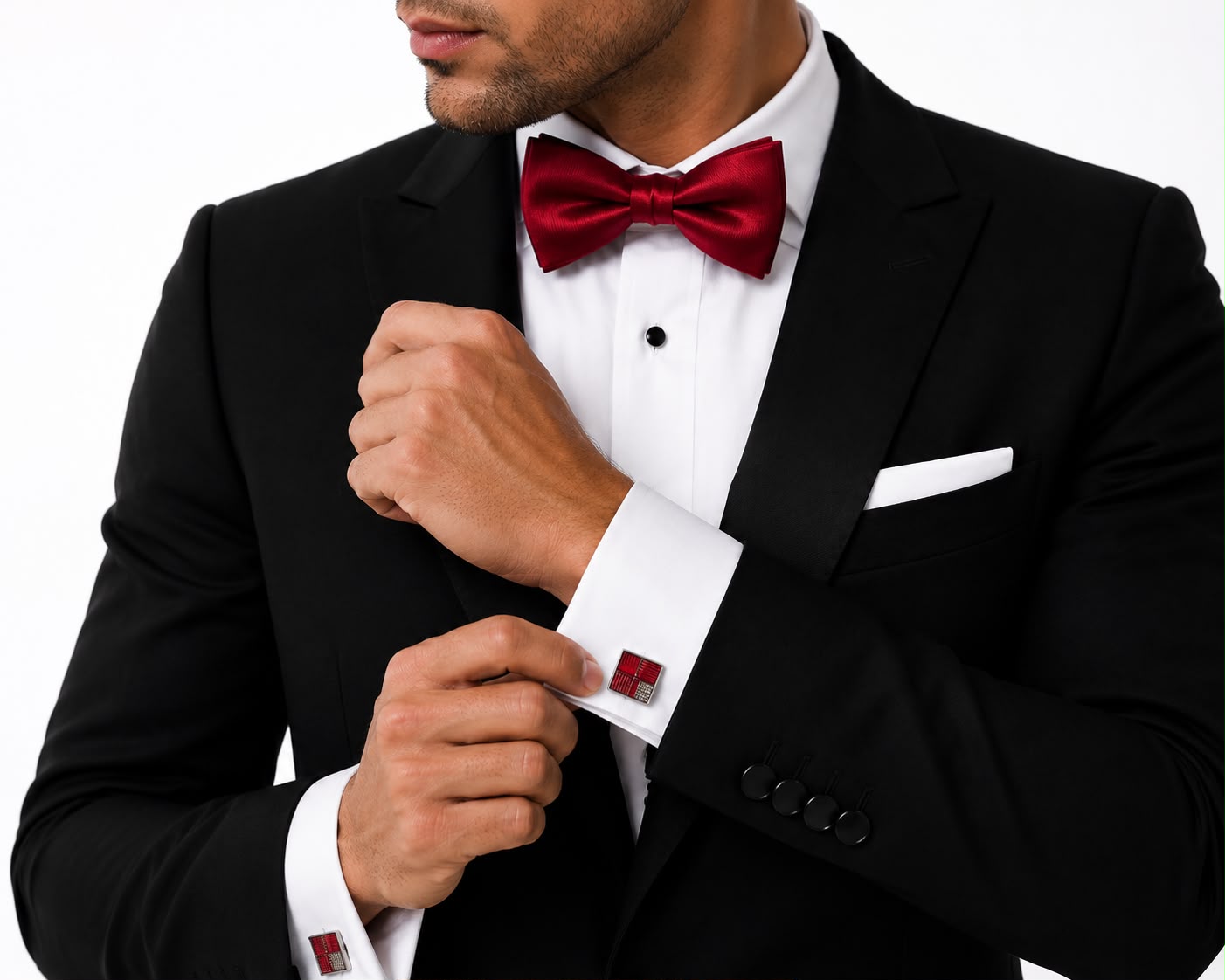 Silver and red check cufflinks worn with a red bow tie and tuxedo